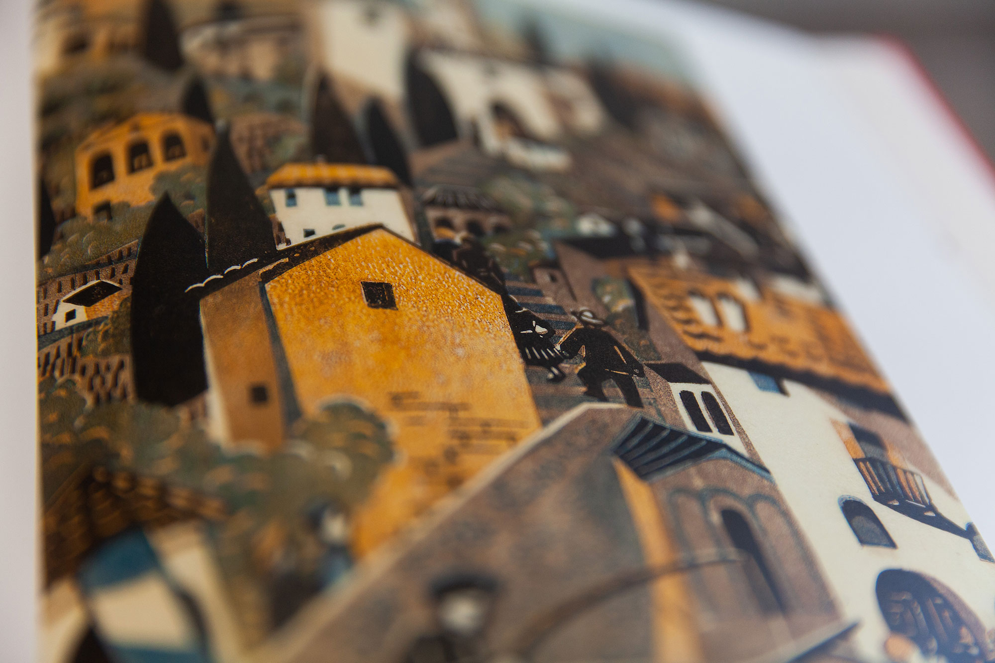 Linolcut by Lili Tschudi. Several houses