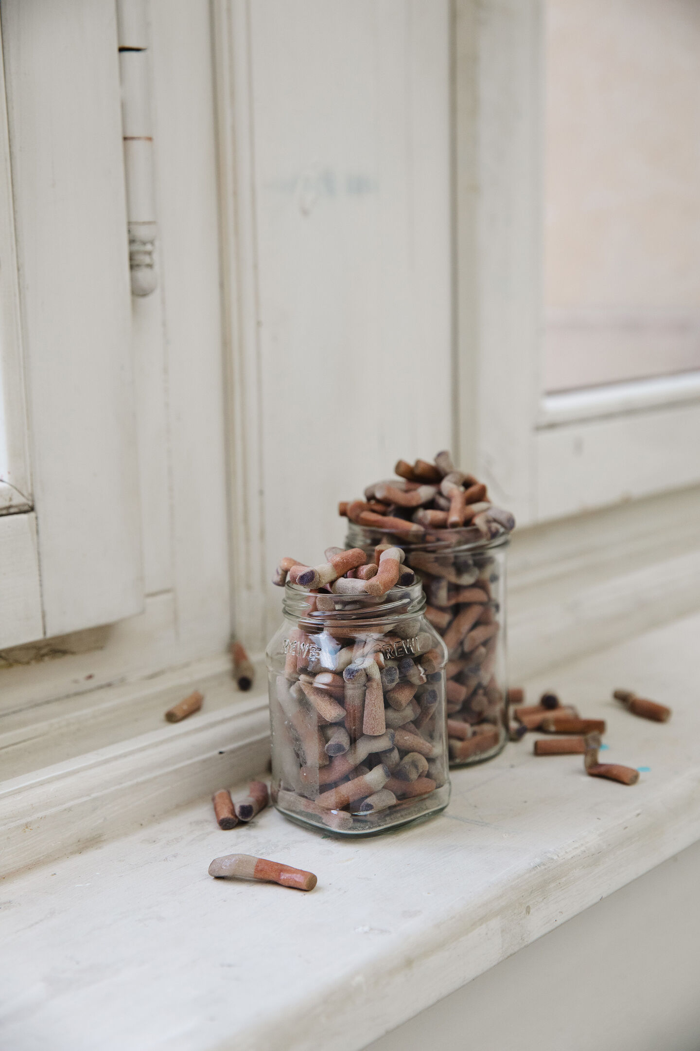 Detail: an ashtray sculpture on a windowsill